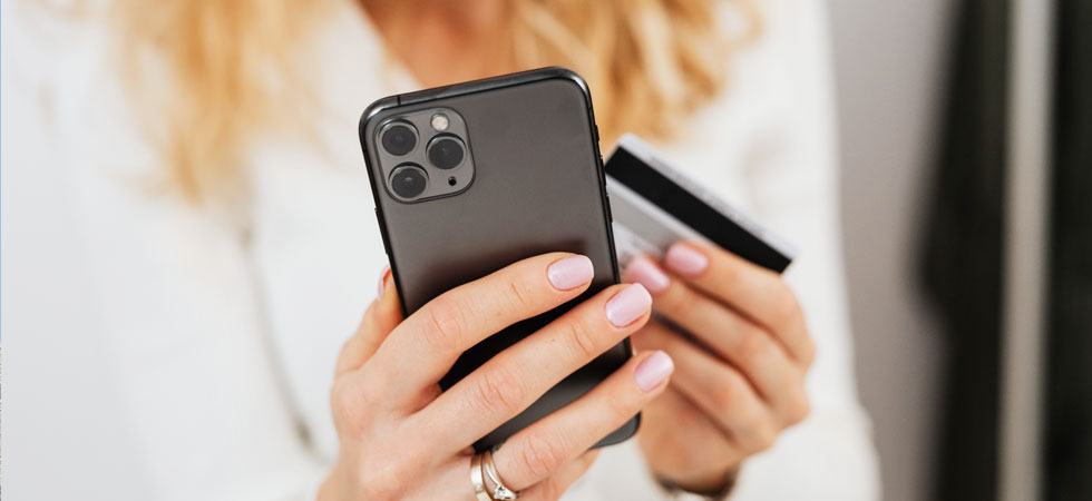 woman-paying-on-phone-with-credit-card