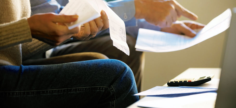 Couple reviewing bills and receipts